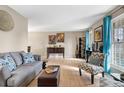 Bright living room with hardwood floors, comfortable seating, and natural light, perfect for relaxation and entertaining guests at 15865 E Kepner Dr, Aurora, CO 80017