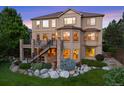 The house features a large deck and a stone patio, perfect for outdoor entertaining and relaxation at 12147 S Shady Pine Ct, Parker, CO 80134