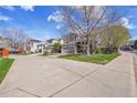 A street view shows a well kept, two-story home with a two car garage at 19447 E Bellisario Creek Dr, Parker, CO 80134