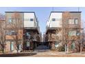 Modern townhome exterior shows unique architectural design with private balconies and front entry at 3619 Navajo St, Denver, CO 80211