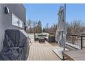 Rooftop deck with grill, umbrella, and patio furniture at 2951 E Evans Ave, Denver, CO 80210