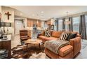 Stylish living room featuring a comfortable sofa and bright, natural light at 8157 E 53Rd Dr, Denver, CO 80238