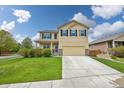 Inviting two-story home with a well-maintained lawn, long driveway and traditional design at 443 Hermosa St, Brighton, CO 80603