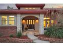 Inviting front entrance with stone walkway and landscaping at 6321 Spotted Fawn Run, Littleton, CO 80125