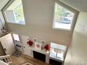Bright living room featuring a fireplace, large windows, and hardwood flooring at 6895 W 84Th Way # 4, Arvada, CO 80003