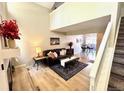 Bright living room boasts vaulted ceilings, neutral paint, and comfortable furnishings at 6895 W 84Th Way # 4, Arvada, CO 80003