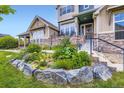 Inviting home with colorful flowers and landscaping in a well-kept front yard at 529 Gallegos Cir, Erie, CO 80516