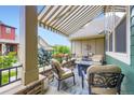 Cozy covered patio with comfortable seating and neutral decor, perfect for relaxing at 529 Gallegos Cir, Erie, CO 80516