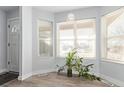 Sunlit entryway with bay window and wood-look floors at 257 Wadsworth Cir, Longmont, CO 80504