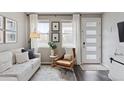 Bright living room featuring a comfortable sofa, modern decor, and an inviting seating arrangement at 21823 E 8Th Ave, Aurora, CO 80018