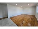 Spacious living room with original hardwood floors and plenty of natural light at 2865 Carnation Way, Thornton, CO 80229