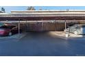 Covered carport parking area with two cars parked under the structure at 1759 Quail St, Lakewood, CO 80215