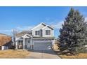 Charming two-story home with well-maintained lawn and inviting curb appeal in a quiet neighborhood at 5232 Creek Way, Parker, CO 80134