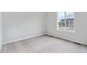 Simple bedroom with carpeted floors and a window at 5710 Ranch St, Mead, CO 80504