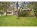 Charming single Gathering home with mature tree, brick exterior and well-manicured front yard at 8269 Zephyr St, Arvada, CO 80005