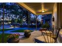 Relaxing front porch view with comfortable seating, potted flowers, and a glimpse of the peaceful neighborhood street at 340 S Logan St, Denver, CO 80209