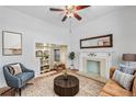 Comfortable living room with a fireplace, large mirror, and views into other rooms at 1563 N Lafayette St, Denver, CO 80218