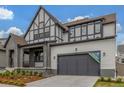 Beautiful two-story home showcasing a gray facade, well-manicured lawn, and an attached two-car garage at 1846 Chestnut Ave, Erie, CO 80516