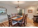 Cozy dining area featuring a classic wooden table with seating for six and neutral wall color at 3265 W 11Th Avenue Ct, Broomfield, CO 80020