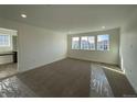 Bright bedroom with neutral carpeting and ample natural light at 544 Twilight St, Erie, CO 80516