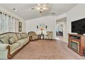 Spacious living room with a fireplace and comfortable seating at 4201 Beautiful Cir, Castle Rock, CO 80109