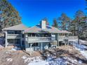 Two-story home with large deck and mountain views at 25060 Montane Drive West, Golden, CO 80401