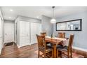 Cozy dining area with hardwood floors, wood table set, and ample closet space at 9315 E Center Ave # 3D, Denver, CO 80247