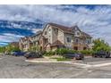 Desirable condominium building with stone accents, well-maintained landscaping, and ample parking at 12711 Colorado Blvd # 714G, Thornton, CO 80241