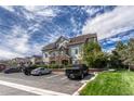 Beautiful condominium building featuring stone accents and well maintained landscaping at 12711 Colorado Blvd # 714G, Thornton, CO 80241