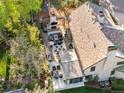 Aerial view of a sprawling outdoor patio complete with a full kitchen, fireplace and comfortable seating at 1991 E Alameda Ave # 14, Denver, CO 80209