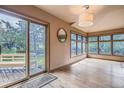 Bright dining room featuring hardwood floors, big windows offering lots of natural light, and a walk-out to the deck at 835 Niagara St, Denver, CO 80220