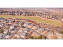 An aerial view of a well-maintained single-Gathering home in a quiet residential neighborhood near a green area at 1339 Bent Grass Cir, Castle Rock, CO 80109