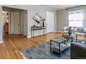 Comfortable living room with hardwood floors, stylish furniture, and natural light at 1416 N Downing St # 1, Denver, CO 80218