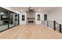 Spacious living room with a modern fireplace and large sliding doors at 461 Muirfield Cir, Louisville, CO 80027
