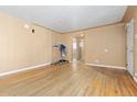 Bright living room featuring hardwood floors, a doorway, and neutral wall colors at 256 King St, Denver, CO 80219