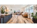 Inviting living room featuring hardwood floors, contemporary furnishings, and bright natural light at 717 S Carr Ave, Lafayette, CO 80026