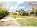 Charming single story home with a well maintained front yard and cozy curb appeal at 2235 Eaton St, Edgewater, CO 80214