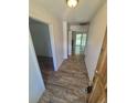 Inviting entryway featuring wood-look flooring that continues through the home and leads to the living spaces at 867 S Grape St, Denver, CO 80246