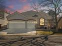 Beautiful stucco home featuring a two-car garage, brick accents, and well-maintained landscaping at 6700 W Dorado Dr # 42, Littleton, CO 80123