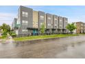 Attractive gray townhome exteriors with well-maintained landscaping along the street at 1285 W 9Th Ave, Denver, CO 80204