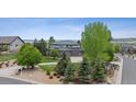 Beautifully landscaped residence features a stone and siding exterior with a well-manicured front yard at 5334 Sedona Dr, Parker, CO 80134
