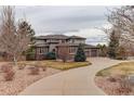 Lovely multi-story home featuring a two-car garage, meticulous landscaping, and a curved driveway at 5334 Sedona Dr, Parker, CO 80134
