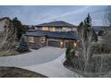 Beautiful two-story home featuring a three-car garage and expansive driveway at 5334 Sedona Dr, Parker, CO 80134