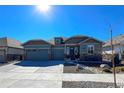 Well-maintained home featuring a three-car garage and a beautifully landscaped yard at 21916 E Swallow Pl, Aurora, CO 80016
