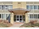 Building entrance with a covered entryway and access to the building at 660 S Alton Way # 10D, Denver, CO 80247