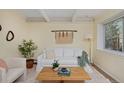 Bright living room showcasing a stylish white sofa, natural wood table, and large, sunlit window at 3580 Broadway St # 3, Boulder, CO 80304