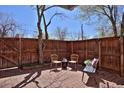 Cozy patio with brick flooring and wood fencing with seating at 3580 Broadway St # 3, Boulder, CO 80304