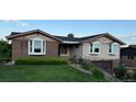 Charming single-Gathering home with brick and siding exterior and well-manicured lawn at 6958 Brentwood Ct, Arvada, CO 80004