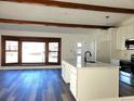 Open-concept kitchen featuring a large island with hardwood flooring at 609 S 1St Ave, Brighton, CO 80601