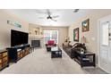 Cozy living room featuring plush carpeting, a fireplace, and comfortable seating at 4084 S Crystal Cir # 104, Aurora, CO 80014